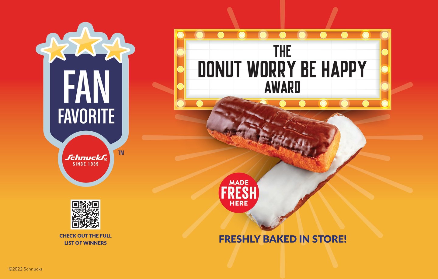 A Schnucks Fan Favorite sign: 'The Donut Worry Be Happy Award' on a marquee above two iced long johns