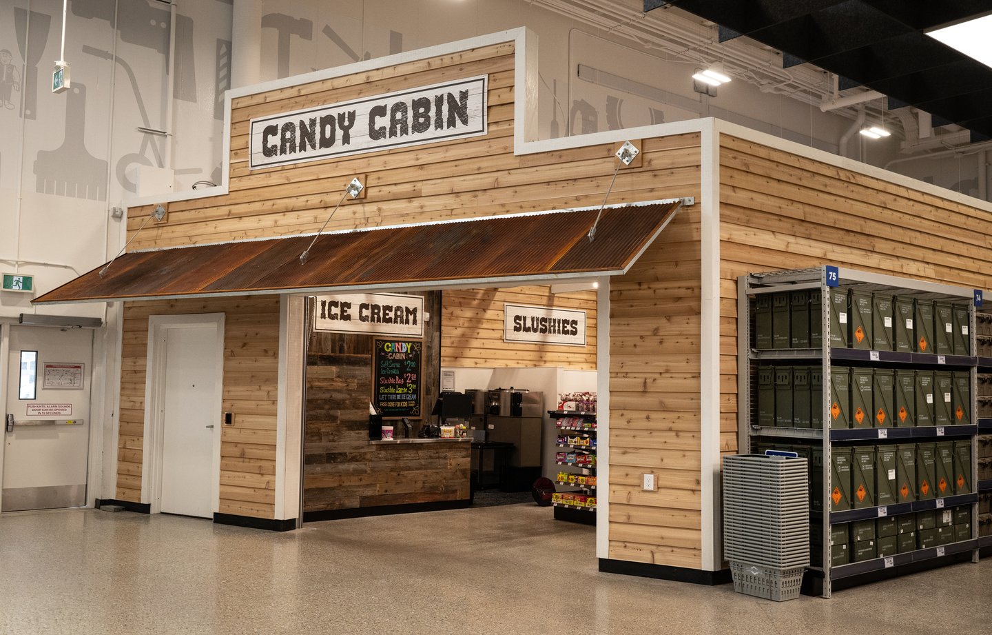 The Candy Cabin at Princess Auto: a wood cabin kiosk selling ice cream and slushies