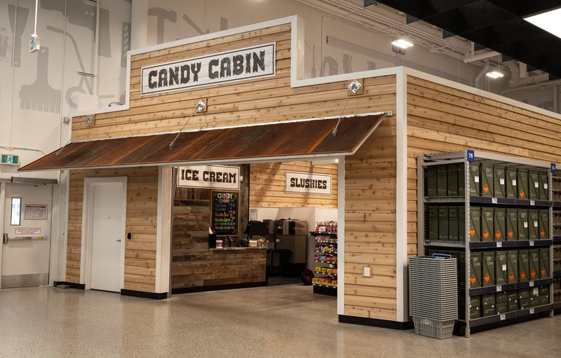 The Candy Cabin at Princess Auto: a wood cabin kiosk selling ice cream and slushies