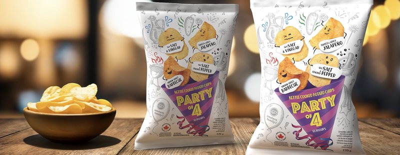 Two Party of 4 kettle cooked chip bags on a wooden table with a bowl of chips, in warm bokeh light