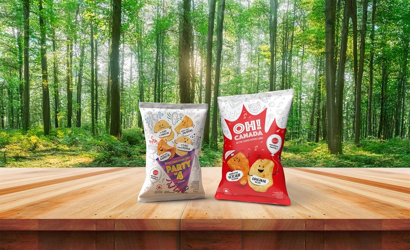 Western Family Party of 4 and Oh! Canada chip bags on a wooden table in a sunlit forest