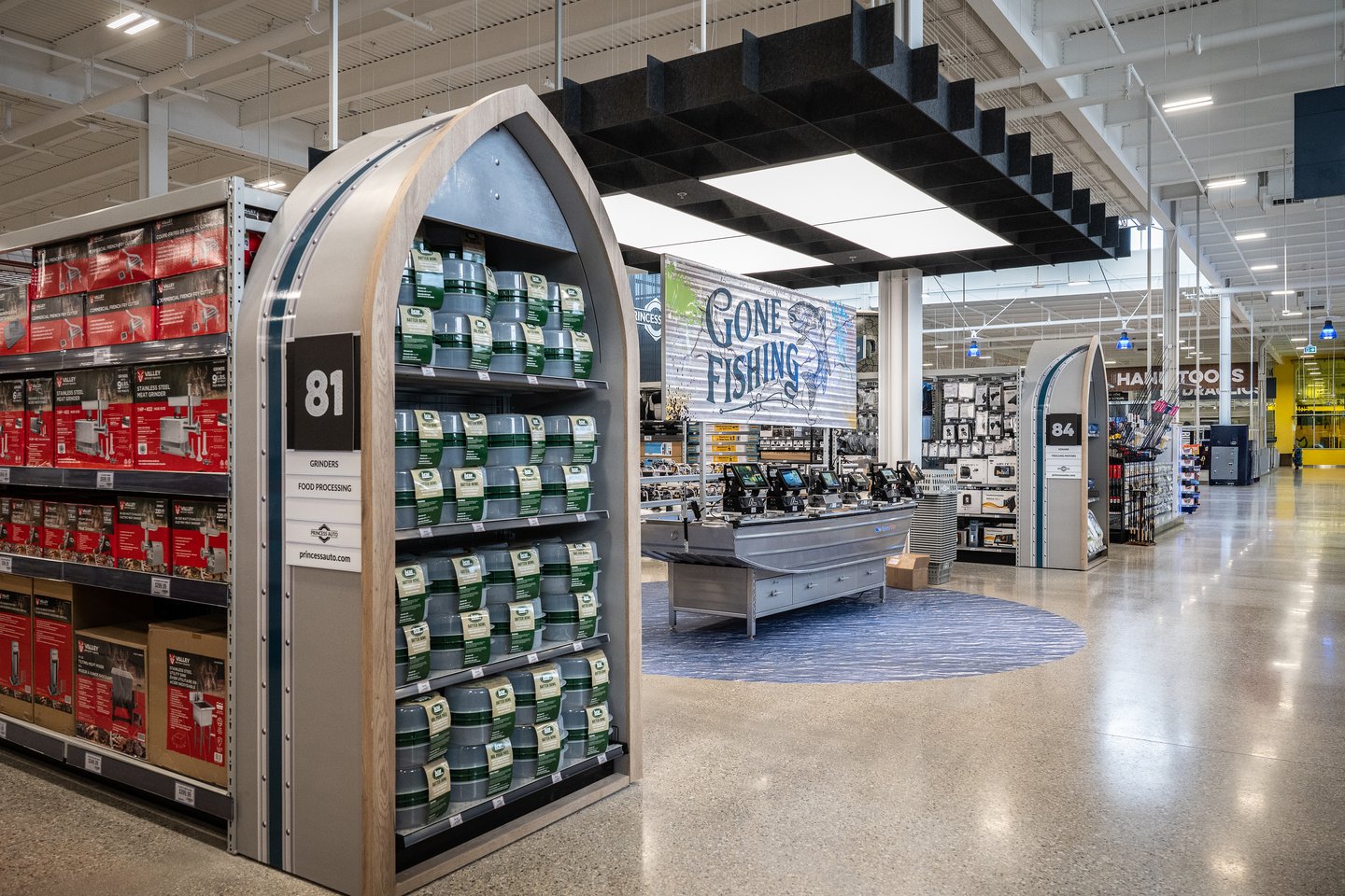 The Gone Fishing department at Princess Auto, with curved end caps of tackle and a boat-shaped display