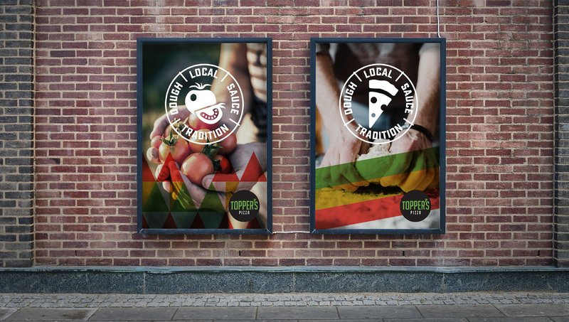 Two framed Topper's posters on a brick wall, each with the Dough Local Sauce Tradition stamp over hands holding pizza ingredients