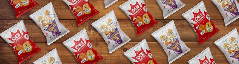 Oh! Canada and Party of 4 chip bags scattered across a wooden table