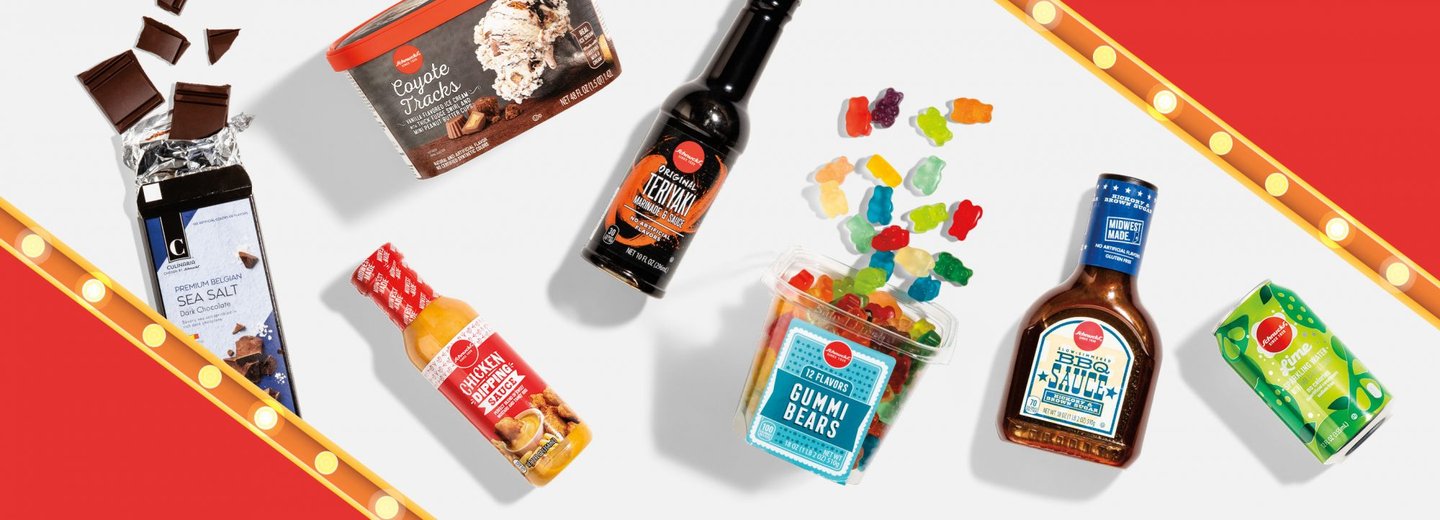 Schnucks Fan Favorite winners between marquee lights: sea salt chocolate, ice cream, hot sauce, gummi bears, teriyaki sauce and sparkling water
