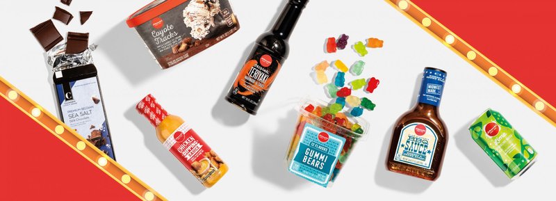 Schnucks Fan Favorite winners between marquee lights: sea salt chocolate, ice cream, hot sauce, gummi bears, teriyaki sauce and sparkling water