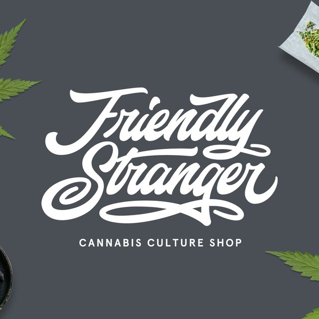 The Friendly Stranger Cannabis Culture Shop script logo in white on dark grey, with cannabis leaves